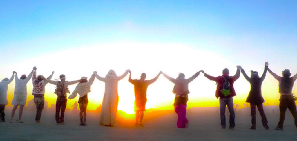 "Sunrise circle of hands" by guano is licensed under CC BY-SA 2.0.