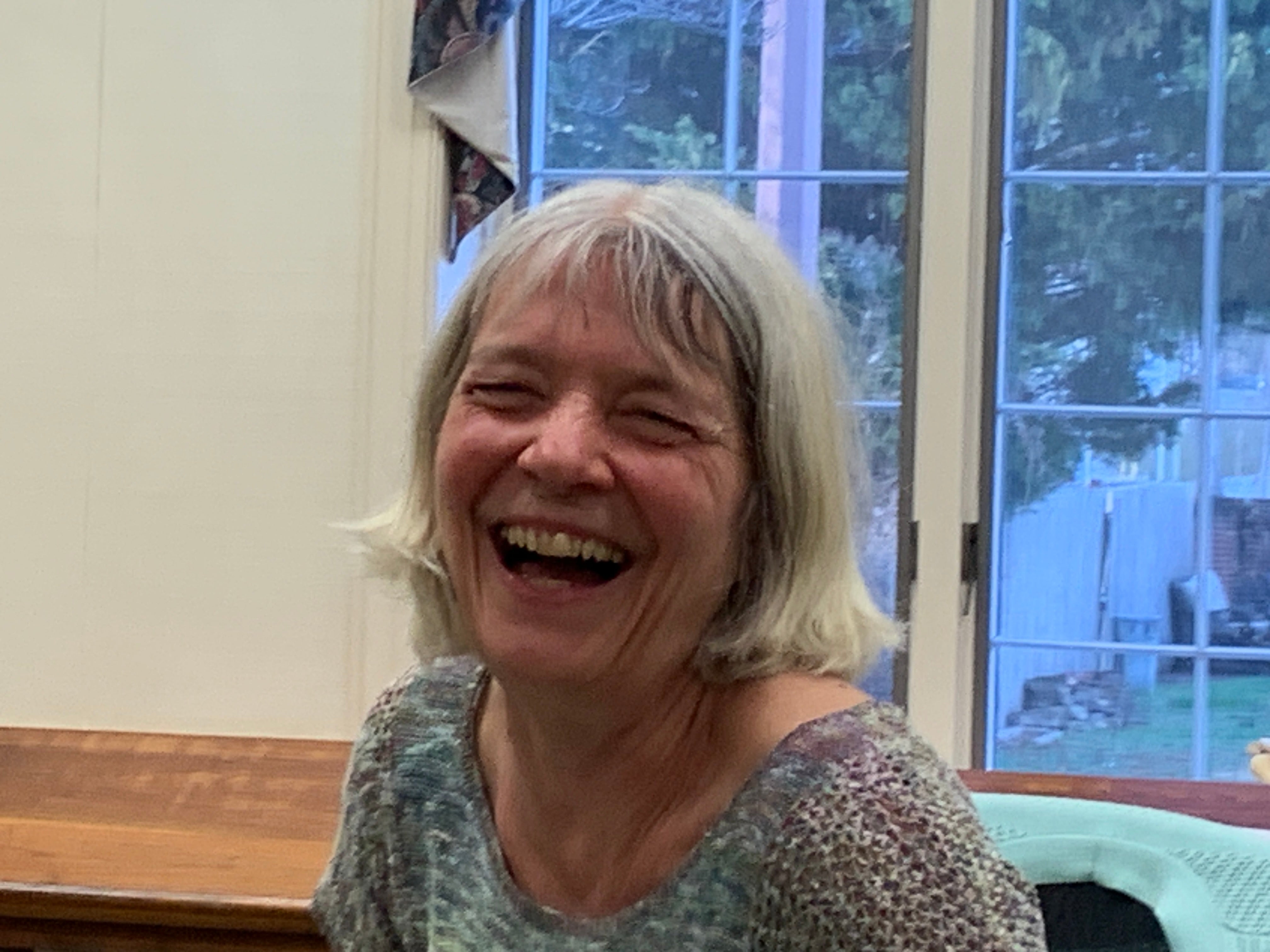 Sandy Jahmi Burg laughing at a Mindful Parenting Talk 2024